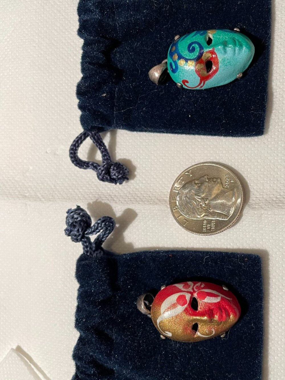 2 sterling silver face pendants